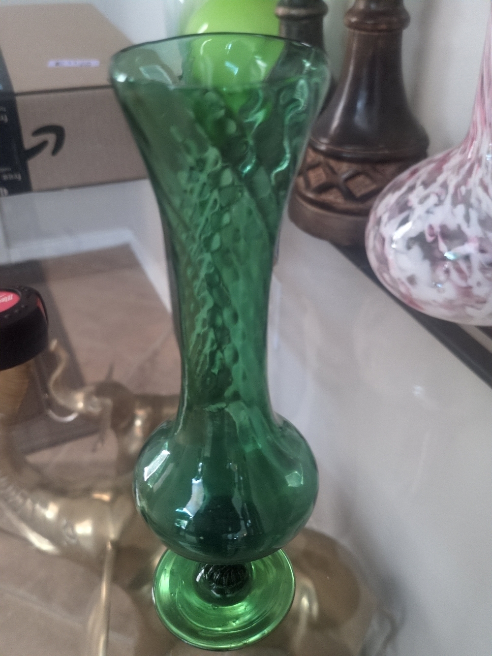 Vintage Hand-blown emerald green glass bud vase with a bulbous base.